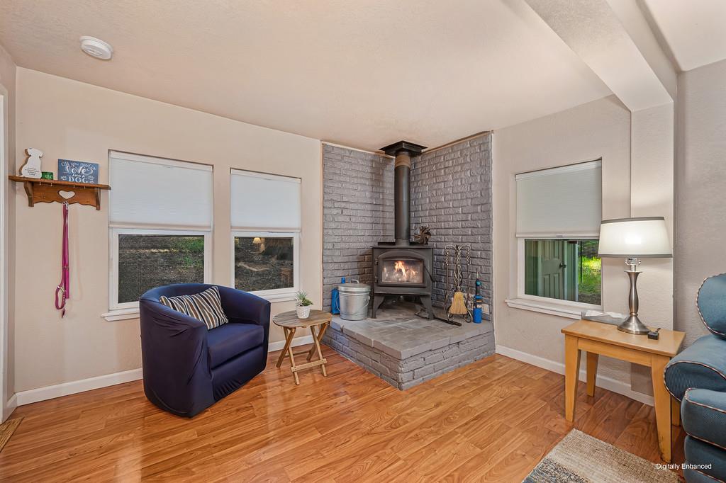 6252 Pony Express Trail Pollock Pines, CA 95726 - Photo 14 of 43 a living room with furniture and a fireplace