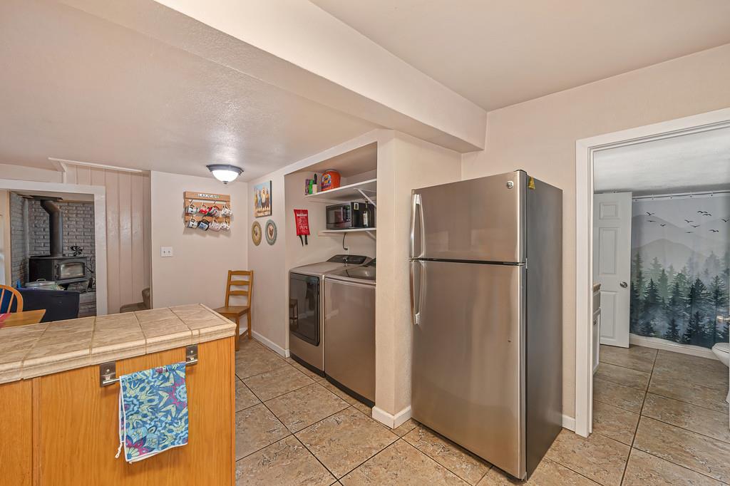 6252 Pony Express Trail Pollock Pines, CA 95726 - Photo 21 of 43 a kitchen with refrigerator and cabinets
