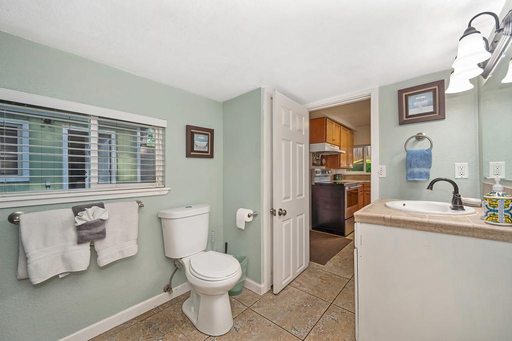 6252 Pony Express Trail Pollock Pines, CA 95726 - Photo 23 of 43 a bathroom with a sink toilet and shower