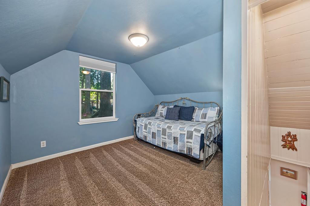 6252 Pony Express Trail Pollock Pines, CA 95726 - Photo 28 of 43 a bedroom with a bed and a window