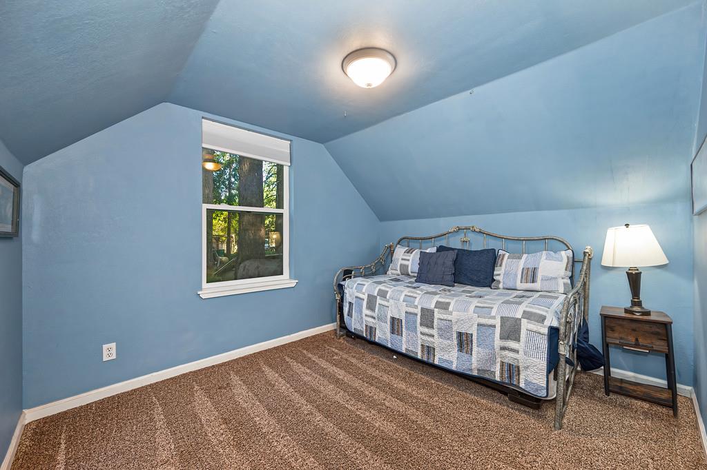 6252 Pony Express Trail Pollock Pines, CA 95726 - Photo 30 of 43 a bedroom with a bed and a window