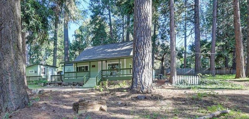 6252 Pony Express Trail Pollock Pines, CA 95726 - Photo 3 of 43 a view of a house with a tree in front of it