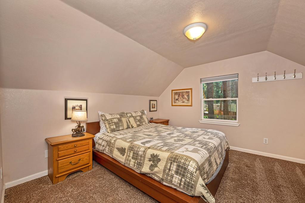 6252 Pony Express Trail Pollock Pines, CA 95726 - Photo 32 of 43 a bedroom with a bed and a window