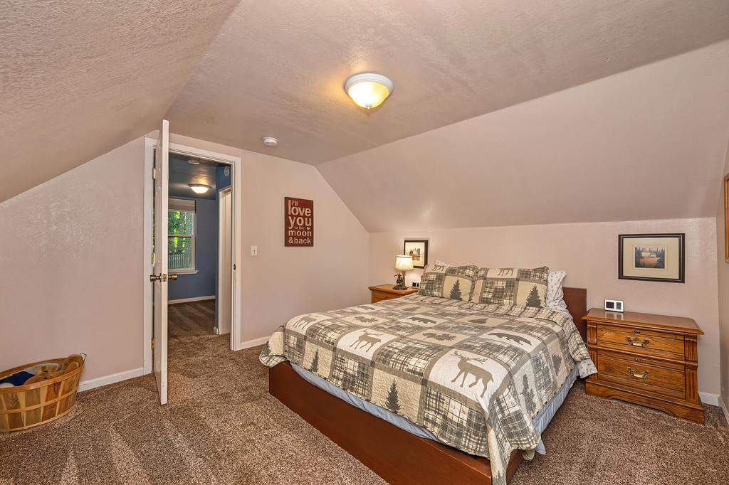 6252 Pony Express Trail Pollock Pines, CA 95726 - Photo 33 of 43 a bedroom with a bed and a desk