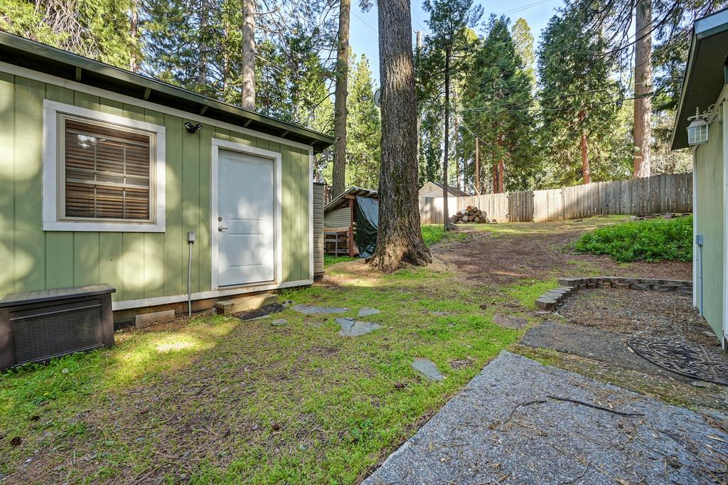 6252 Pony Express Trail Pollock Pines, CA 95726 - Photo 35 of 43 a backyard of a house with barbeque oven