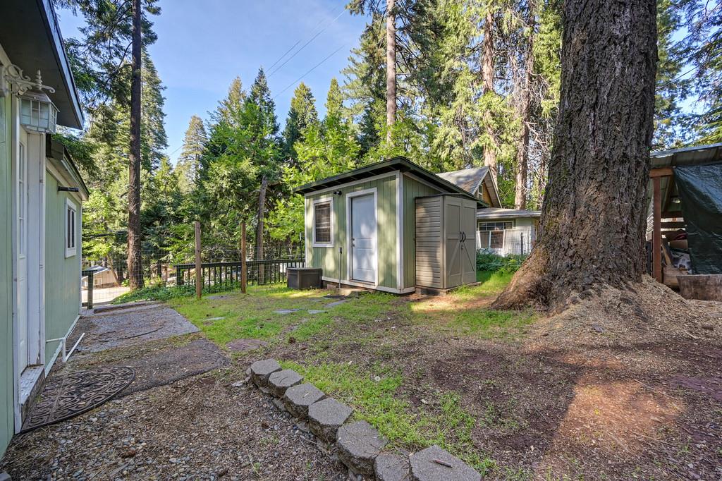6252 Pony Express Trail Pollock Pines, CA 95726 - Photo 36 of 43 a view of a house with yard and tree s