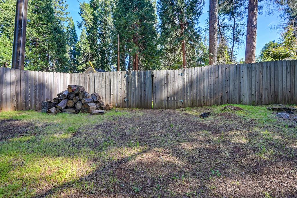 6252 Pony Express Trail Pollock Pines, CA 95726 - Photo 39 of 43 a garden with wooden fence