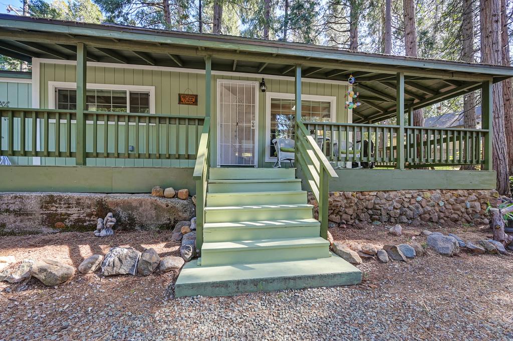 6252 Pony Express Trail Pollock Pines, CA 95726 - Photo 4 of 43 a front view of a house with a yard