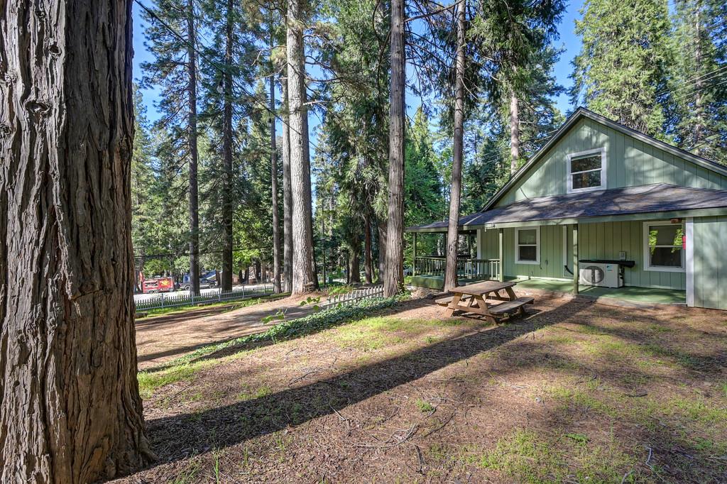 6252 Pony Express Trail Pollock Pines, CA 95726 - Photo 41 of 43 a view of a house with backyard and sitting area