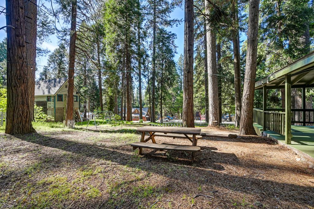 6252 Pony Express Trail Pollock Pines, CA 95726 - Photo 42 of 43 a view of a house with backyard and sitting area