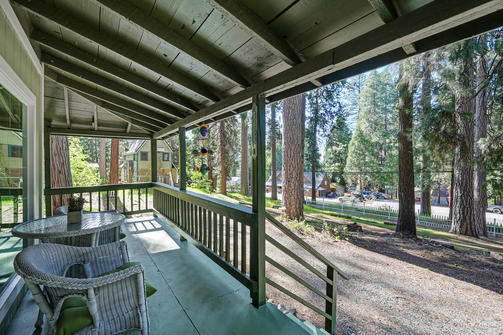 6252 Pony Express Trail Pollock Pines, CA 95726 - Photo 7 of 43 a view of a porch with furniture and garden
