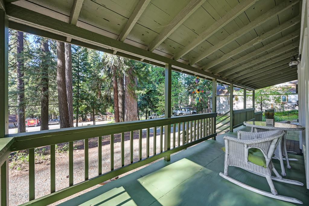 6252 Pony Express Trail Pollock Pines, CA 95726 - Photo 8 of 43 a view of a porch with furniture and a backyard
