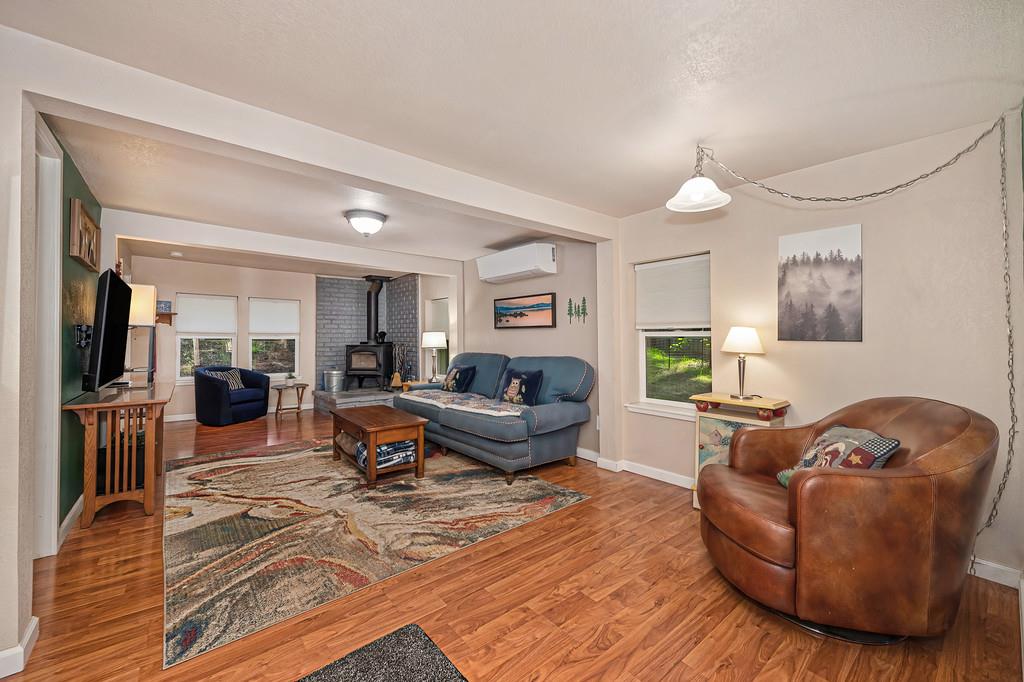 6252 Pony Express Trail Pollock Pines, CA 95726 - Photo 10 of 43 a living room with furniture and a wooden floor