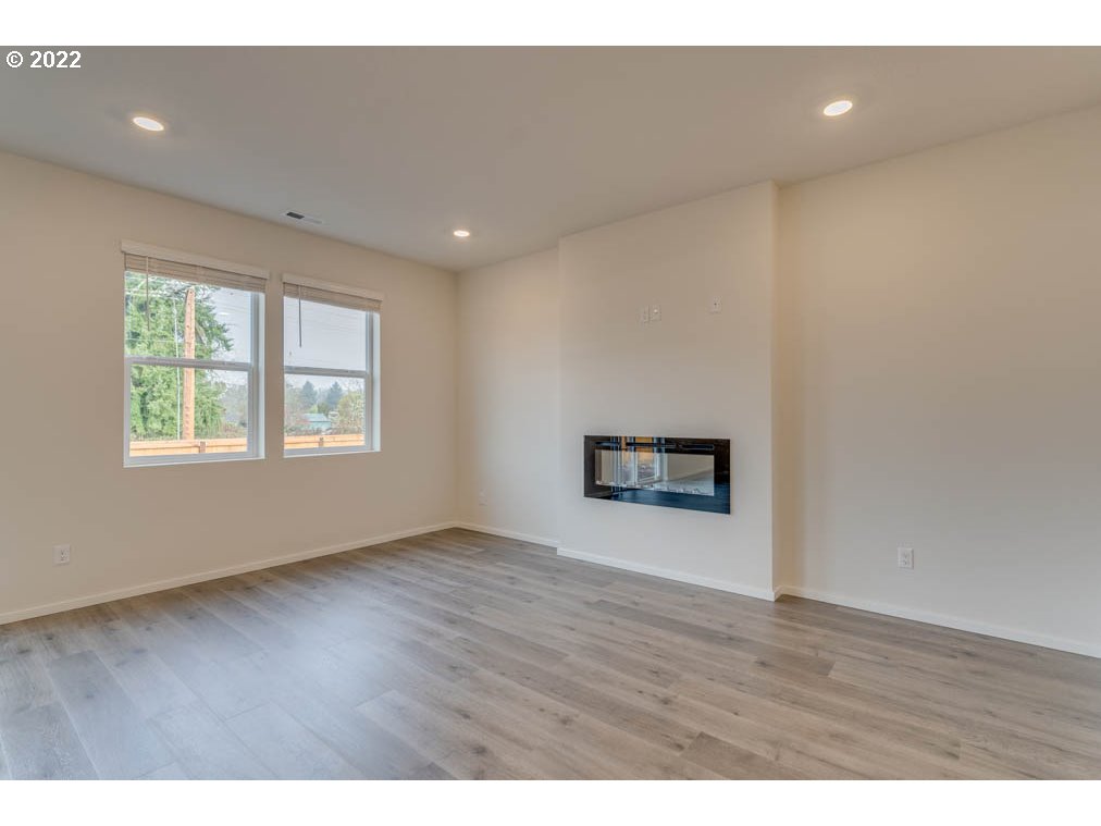 2910 Fenya Street Springfield, OR 97477 - Photo 15 of 23 a view of an empty room with wooden floor and a window