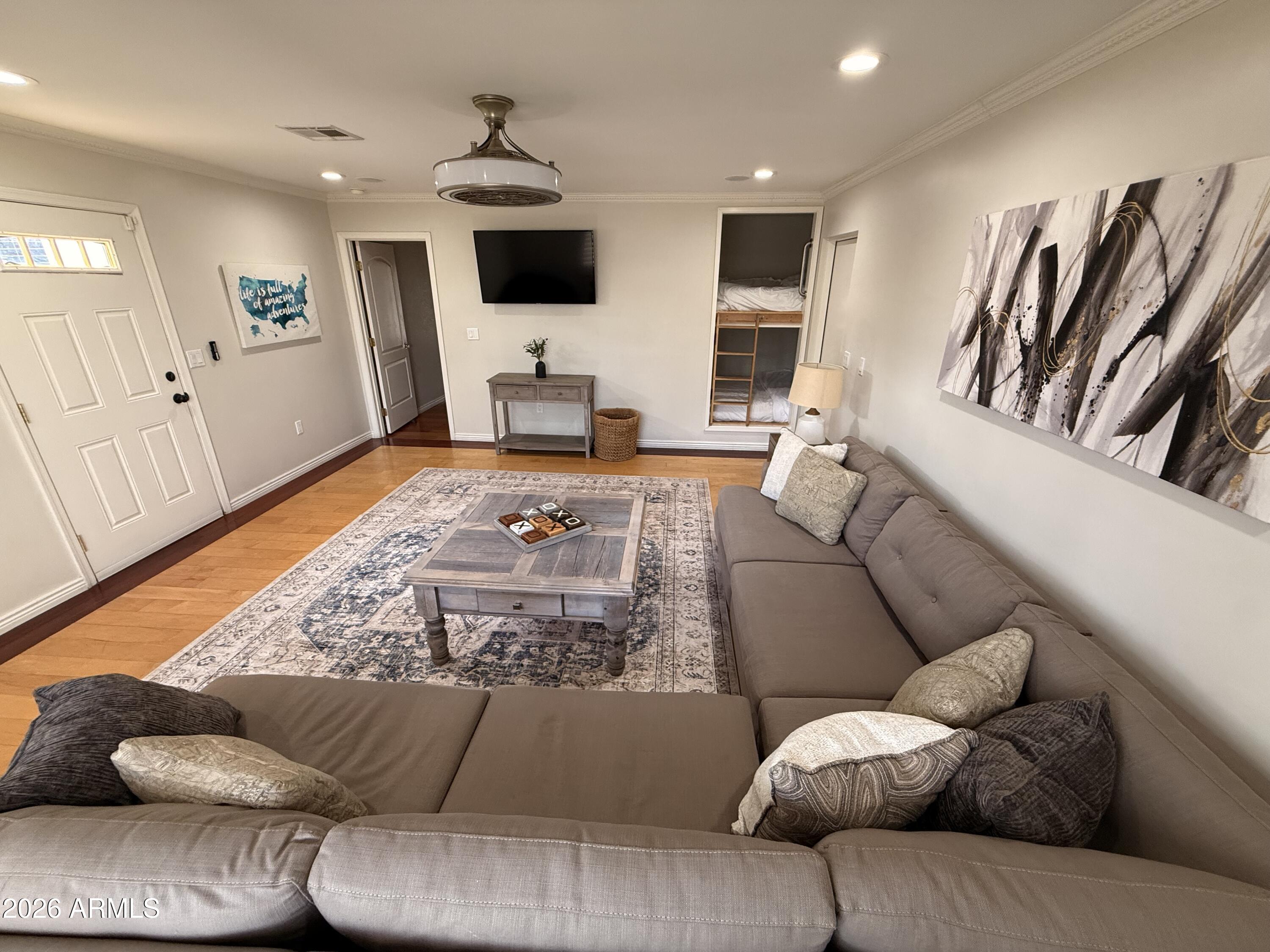 6932 East Presidio Road Scottsdale, AZ 85254 - Photo 26 of 30 a living room with furniture and a flat screen tv