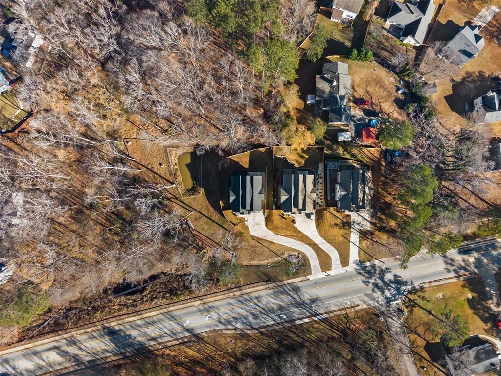 658 Rockbridge Road Northwest Lilburn, GA 30047 - Photo 55 of 61 a view of a house with a yard