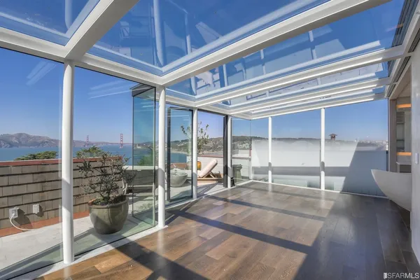 a living room with furniture a mirror and a window