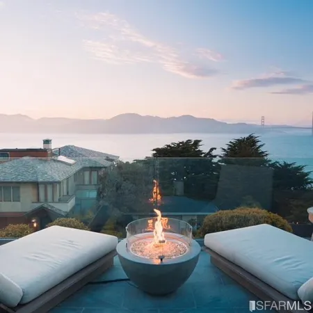 a outdoor living room with furniture and garden view