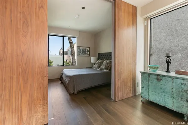 a bedroom with a bed and a view of bedroom