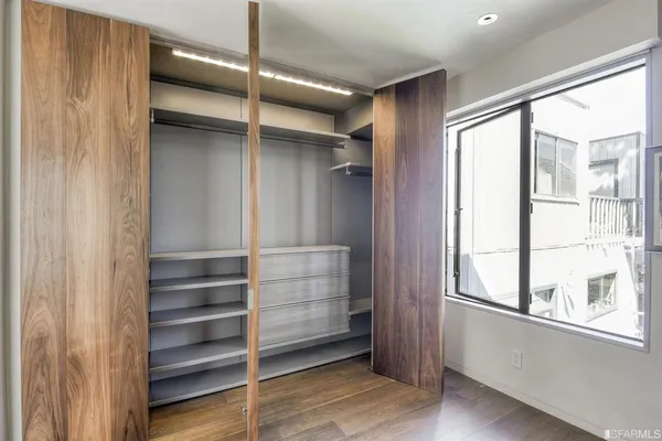 a bathroom with a double vanity sink and shower