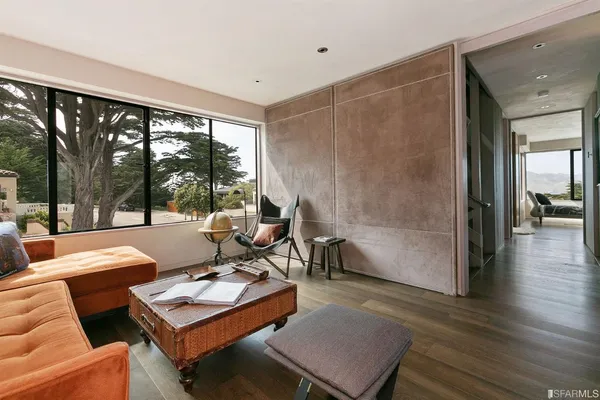 a very nice looking room with a large window and chandelier