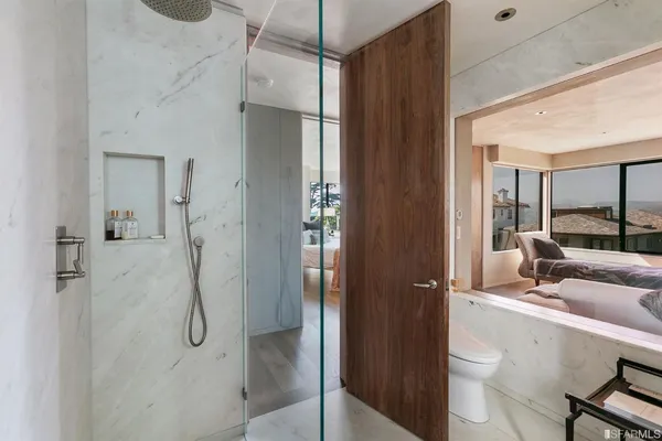 a view of entryway with wooden floor and stairs