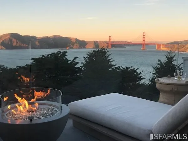 a kitchen with stainless steel appliances granite countertop sink stove and large window
