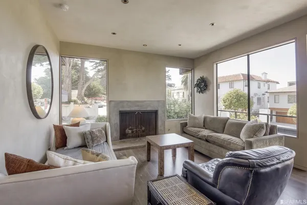 a living room with a large window and a couch
