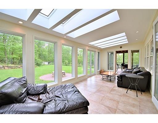 46 Meadow Road Bolton, MA 01740 - Photo 11 of 29 a living room with furniture and large windows