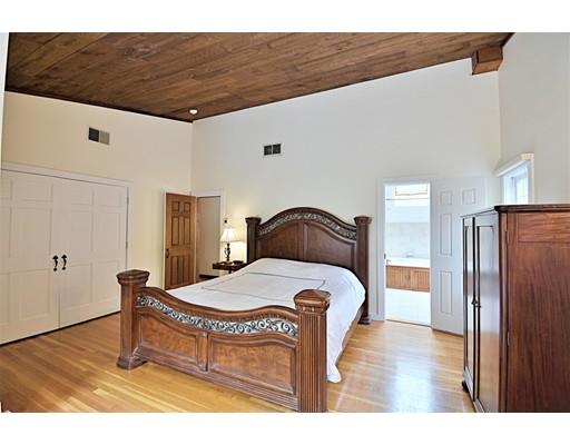 46 Meadow Road Bolton, MA 01740 - Photo 15 of 29 a bed room with a bed and a table
