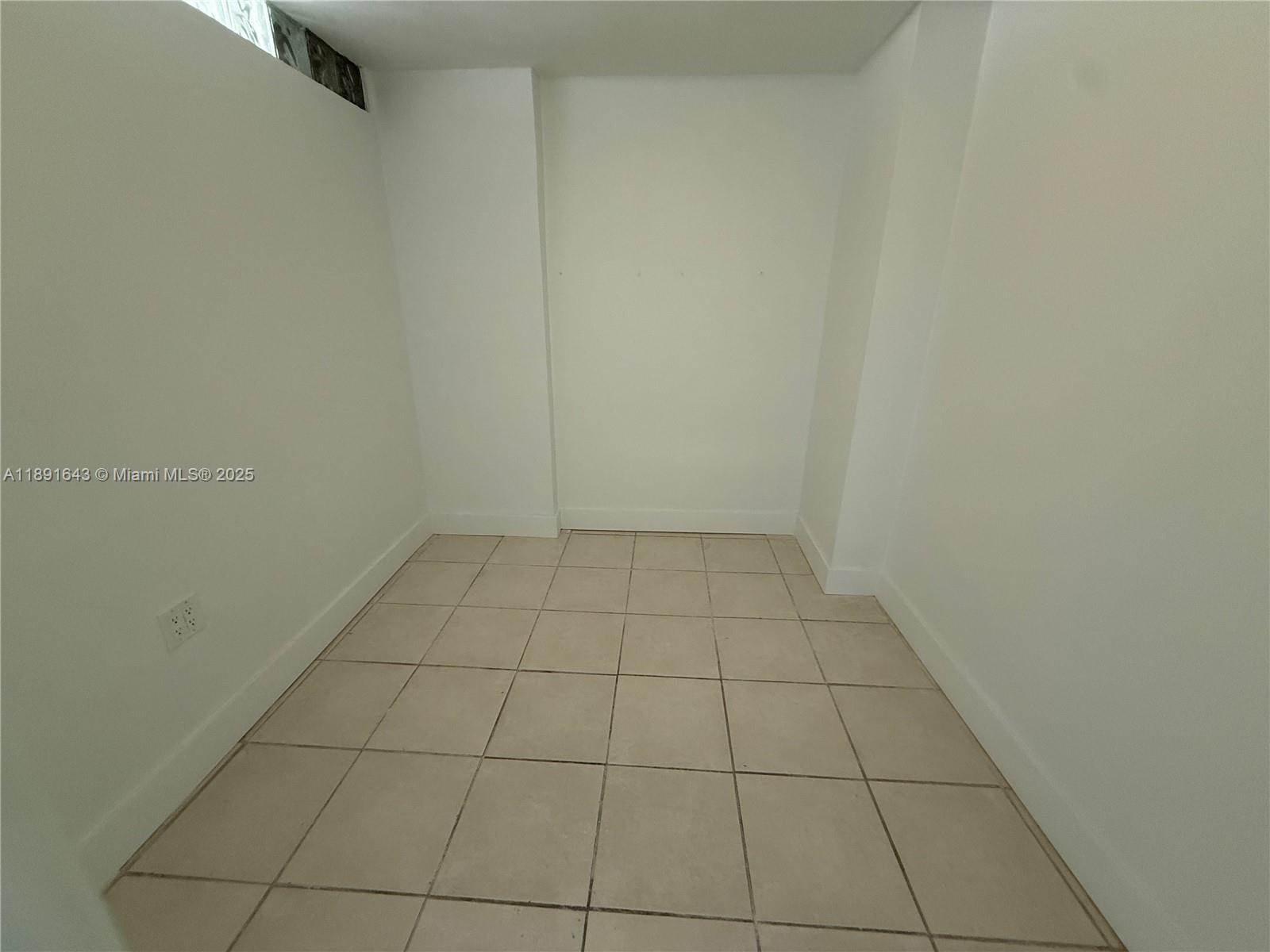 5005 Collins Avenue, Unit 823 Miami Beach, FL 33140 - Photo 28 of 34 a view of an empty room