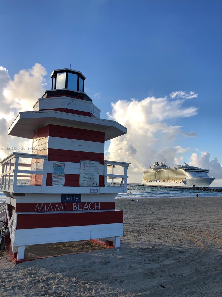 5005 Collins Avenue, Unit 823 Miami Beach, FL 33140 - Photo 31 of 34 a front view of a house with a yard