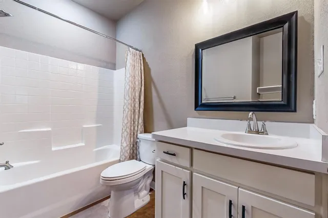 a bathroom with a toilet a sink and a bathtub