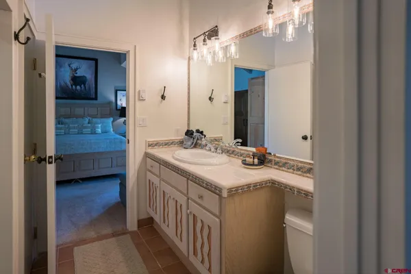 a bathroom with a sink a double vanity and a mirror
