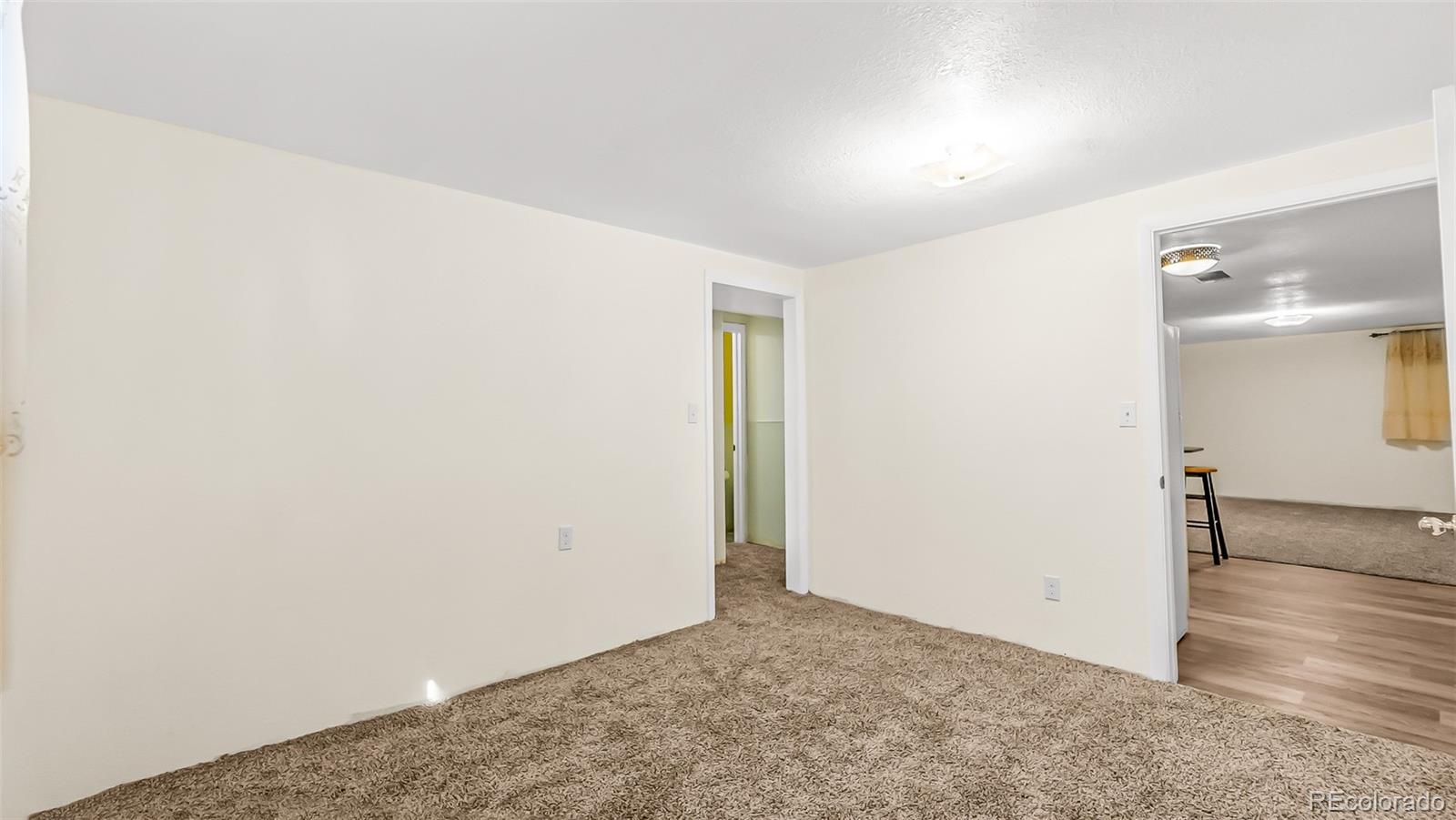 251 West 5th Street Akron, CO 80720 - Photo 19 of 30 an empty room with wooden floor