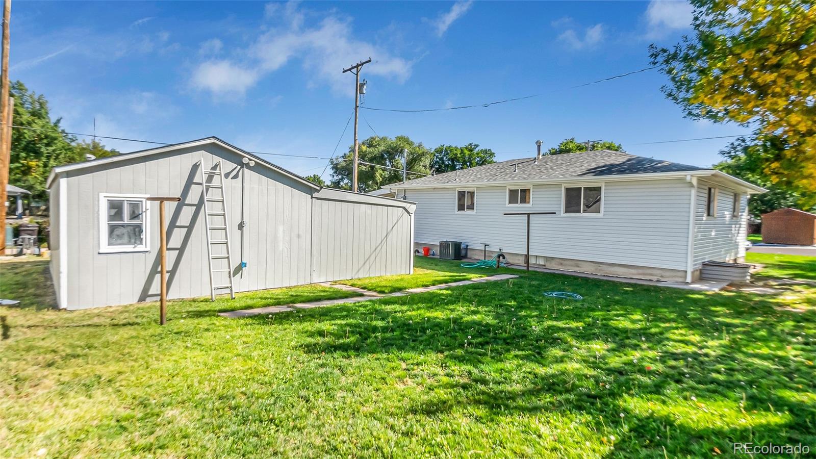 251 West 5th Street Akron, CO 80720 - Photo 27 of 30 a view of a house with backyard and garden
