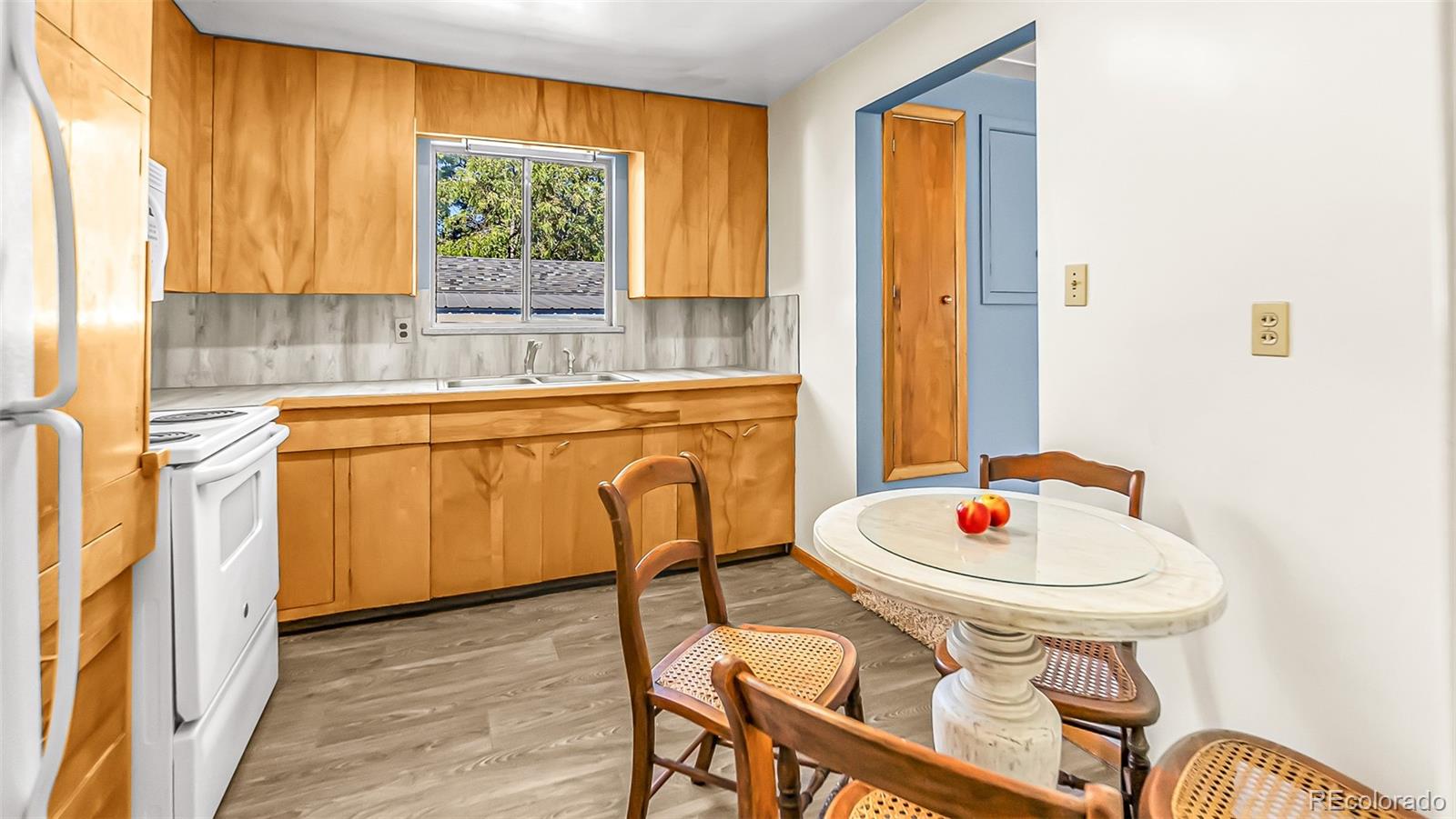 251 West 5th Street Akron, CO 80720 - Photo 6 of 30 a kitchen with a table and chairs in it