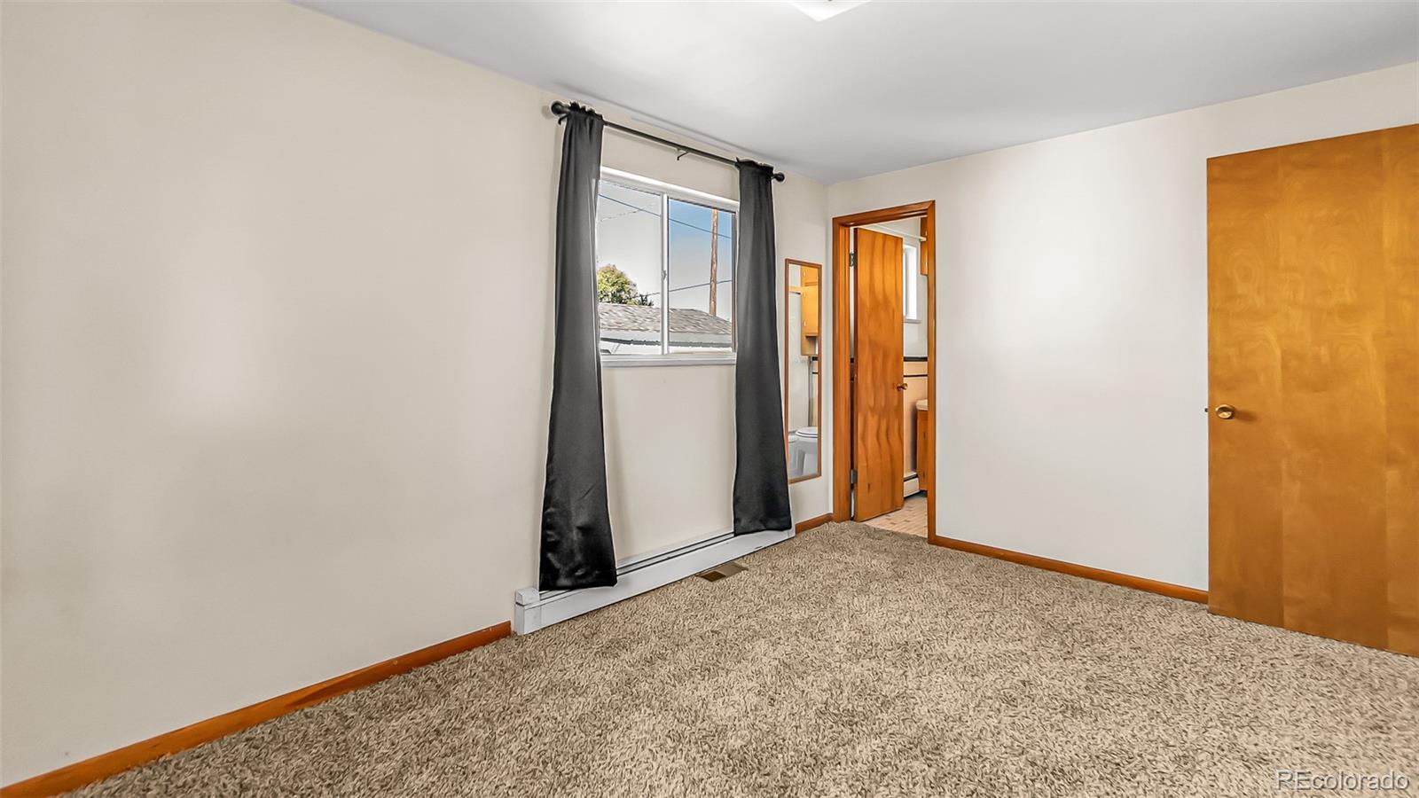 251 West 5th Street Akron, CO 80720 - Photo 8 of 30 a view of an empty room with a window