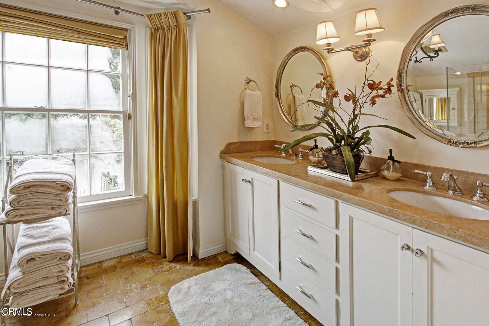 175 Glen Summer Road Pasadena, CA 91105 - Photo 14 of 26 a bathroom with a sink and a mirror