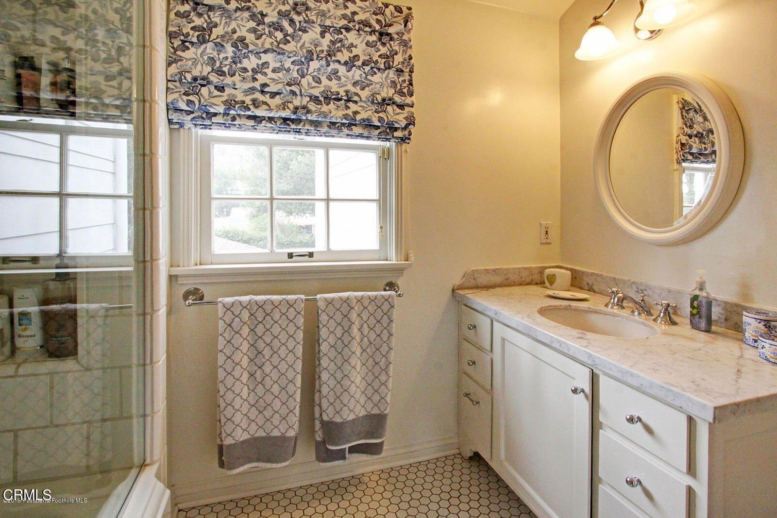 175 Glen Summer Road Pasadena, CA 91105 - Photo 19 of 26 a bathroom with a granite countertop sink and a mirror