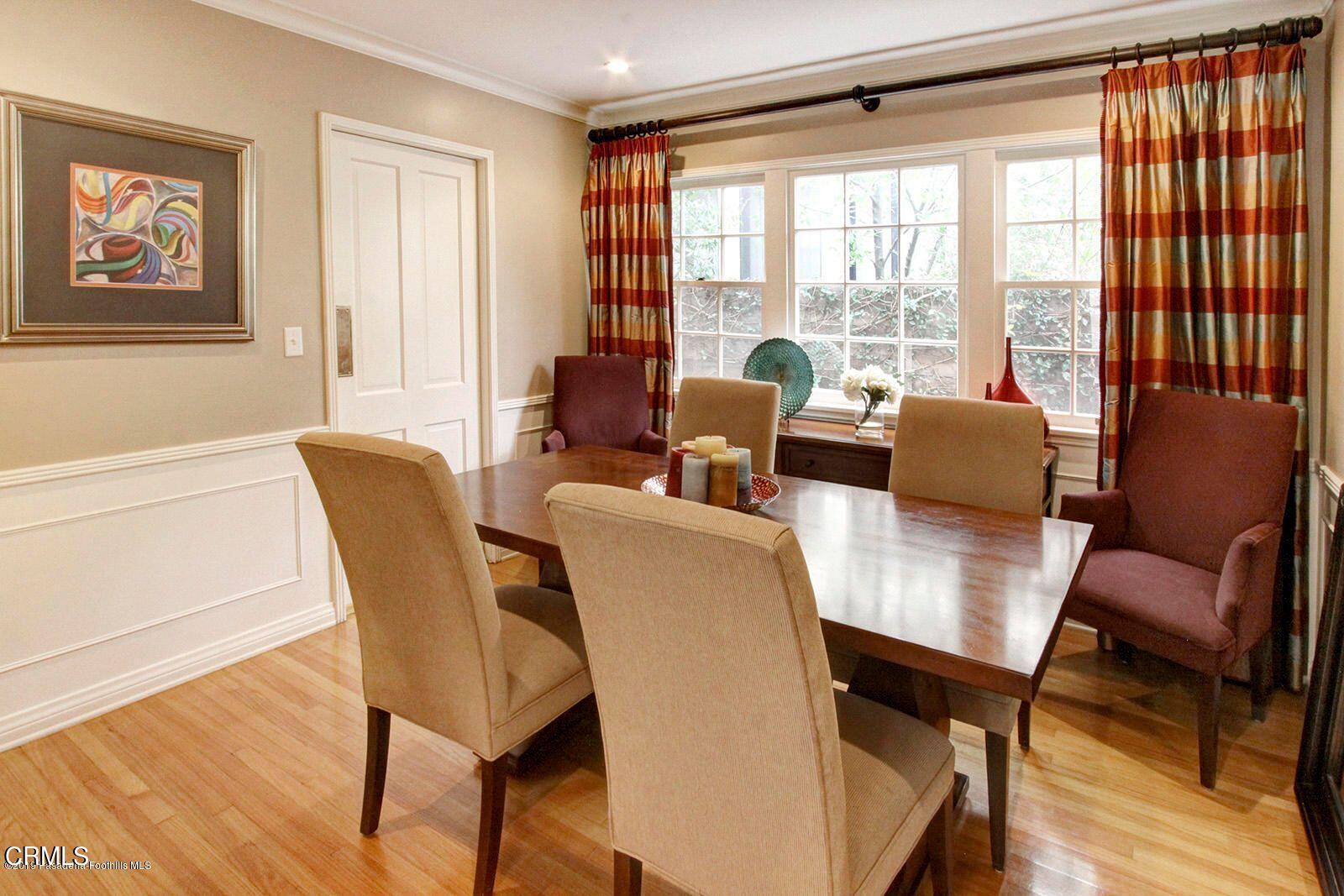 175 Glen Summer Road Pasadena, CA 91105 - Photo 5 of 26 a view of a dining room with furniture large window and wooden floor