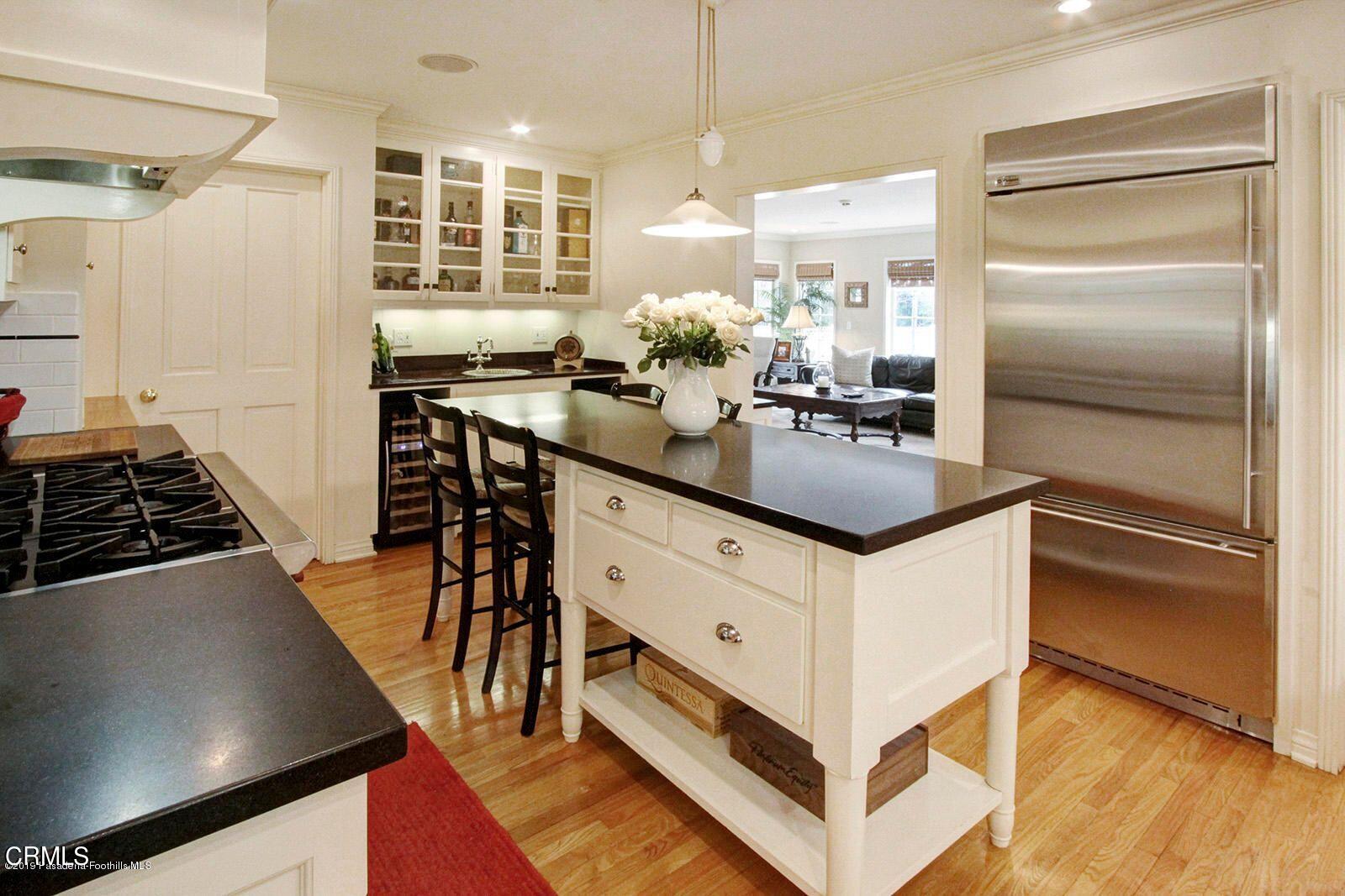 175 Glen Summer Road Pasadena, CA 91105 - Photo 6 of 26 a kitchen with stainless steel appliances granite countertop a stove and a refrigerator