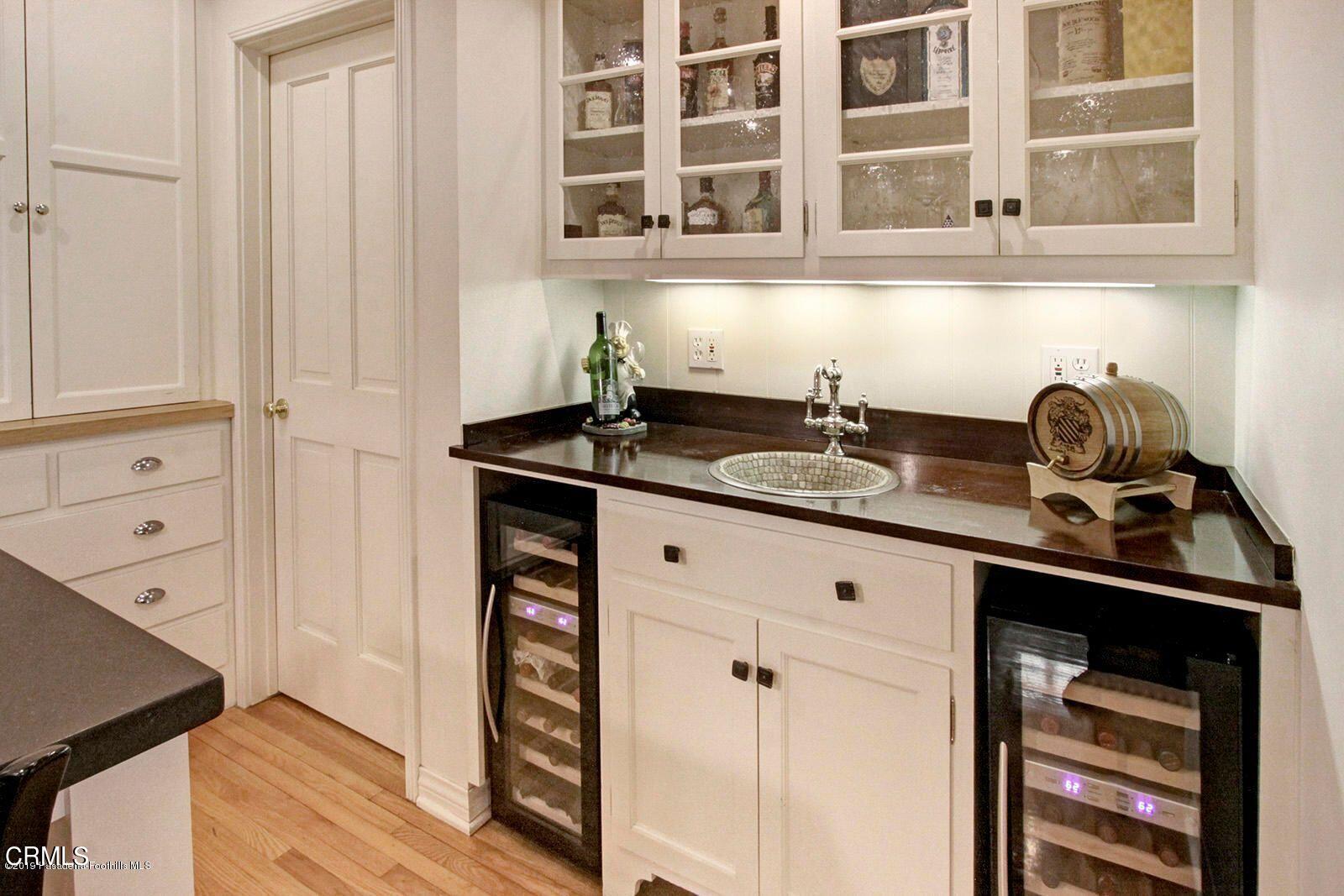 175 Glen Summer Road Pasadena, CA 91105 - Photo 8 of 26 a kitchen with stainless steel appliances granite countertop a sink and a stove next to a window