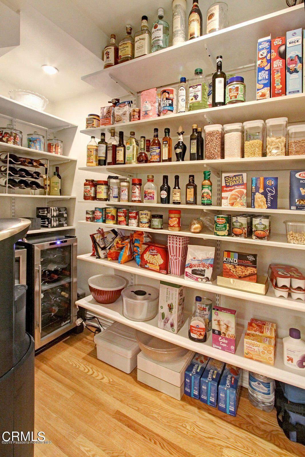 175 Glen Summer Road Pasadena, CA 91105 - Photo 10 of 26 a room with lots of books and knick knacks on it