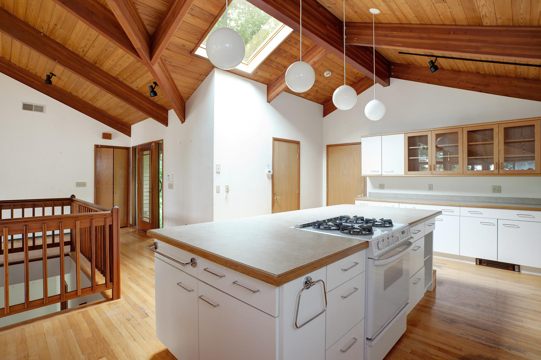 170 Pimlico Pond Road Mashpee, MA 02649 - Photo 7 of 29 a kitchen with stainless steel appliances granite countertop a stove a sink dishwasher and white cabinets with wooden floor