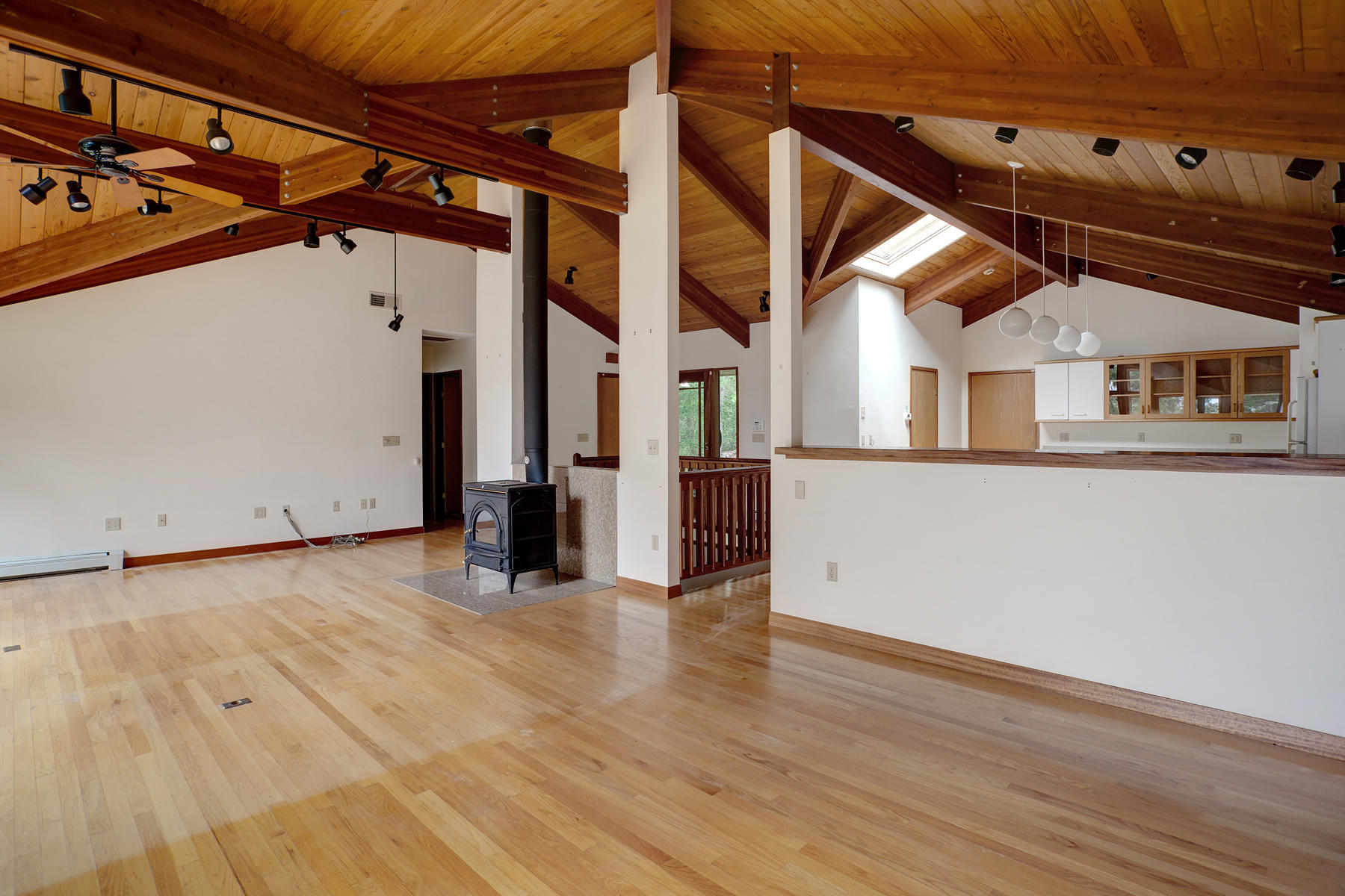 170 Pimlico Pond Road Mashpee, MA 02649 - Photo 10 of 29 an empty room with wooden floor and windows