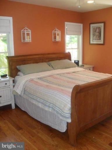 1702 Brookshire Run Point of Rocks, MD 21777 - Photo 8 of 21 a bedroom with a bed and wooden floor