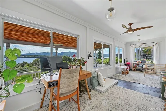a view of a dining room with furniture window and outside view