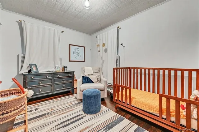 a room with furniture a rug and a window