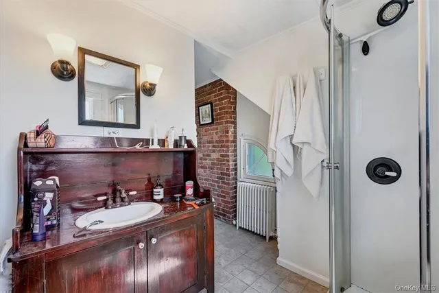 a bathroom with a sink and mirror